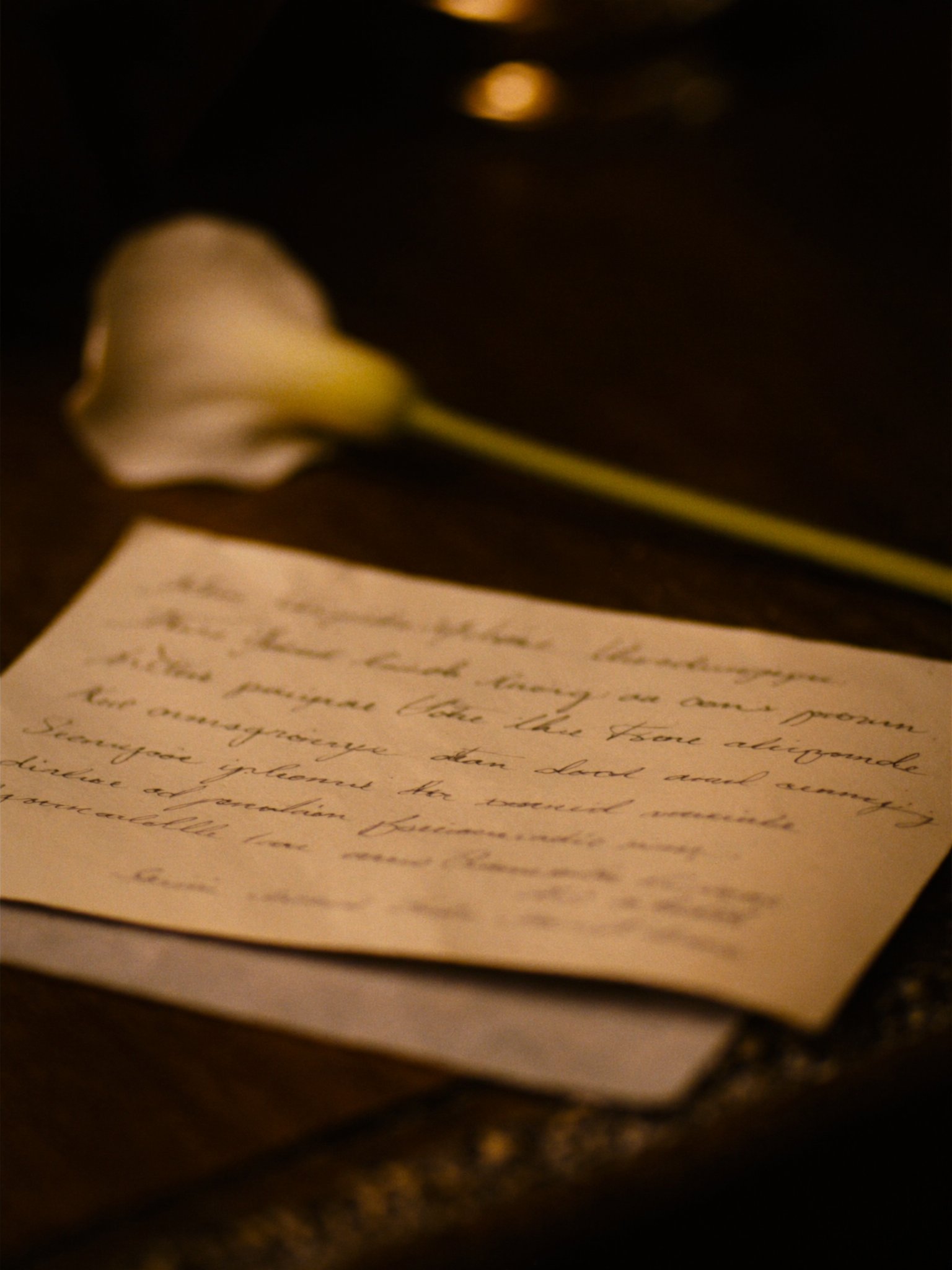 Handwritten note and calla lily